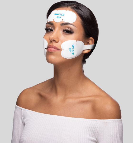 A woman with an Emface device on her face.